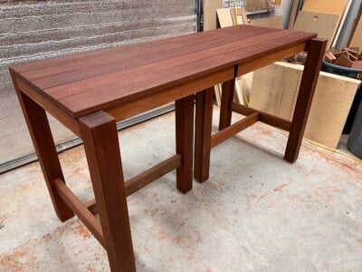 two hardwood tables pushed together to make a longer table