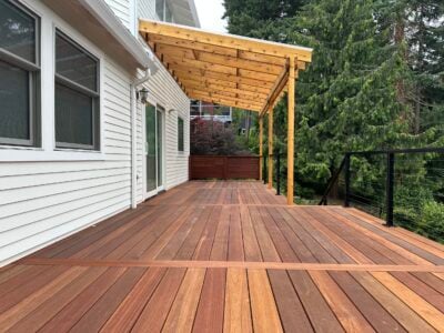 Batu deck built by AB Construction LLC with DW Construction LLC A batu tropical hardwood deck with a patio cover.