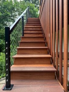 Batu deck built by AB Construction LLC with DW Construction LLC Batu stairs with a aluminum handrail.