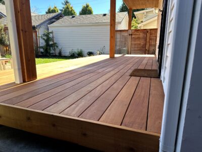 Close-up of premium Ipe decking boards, showcasing rich grain, smooth finish, and precise milling for outdoor spaces.