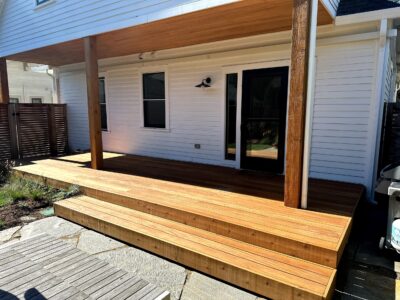 Premium Ipe hardwood decking boards with rich grain and texture, featuring smooth, finished surfaces and sturdy construction.