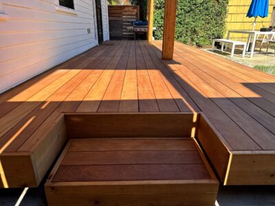 Ipe hardwood decking boards with rich grain and warm finish, showcasing premium hardwood planks and step profile details.