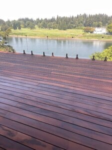 A tigerwood deck overlooking a river.