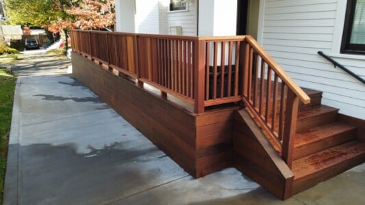 IPE deck with Fijian Mahogany rail and Japanese Cedar ceiling planks by AB Construction LLC IPE deck with Fijian Mahogany rail