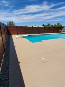 pool with a hardwood fence around it