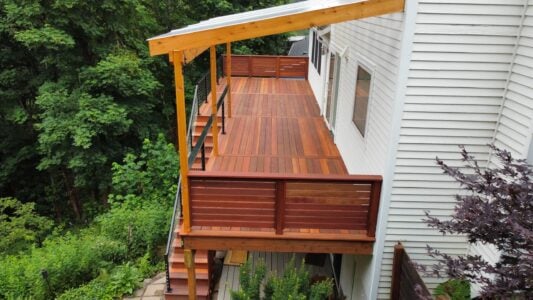 Batu deck built by AB Construction LLC with DW Construction LLC Batu wood balcony and railing.