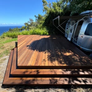 batu hardwood deck outside an airstream overlooking the water
